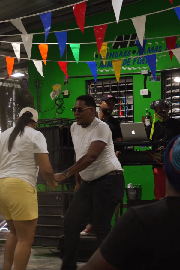 Dancers at a local social decorated with colorful bunting in Santo Domingo